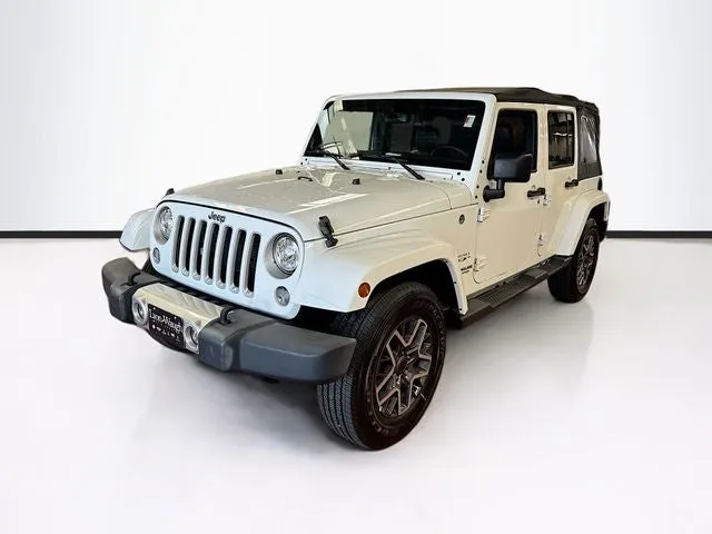 2017 Jeep Wrangler Unlimited Sahara in Bright White Clearcoat — front three-quarter view