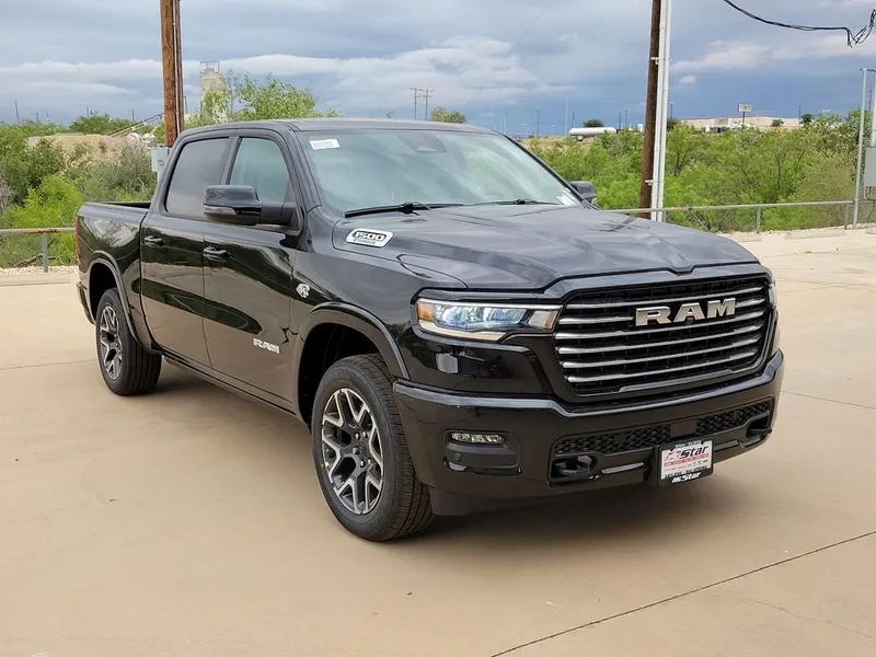 2026 RAM 1500 Laramie in Diamond Black Crystal Pearlcoat — front three-quarter view