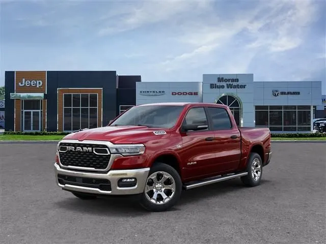 2026 RAM Ram 1500 RAM 1500 BIG HORN CREW CAB 4X4 5'7' BOX in Molten Red Pearl-Coat Exterior Paint — front three-quarter view