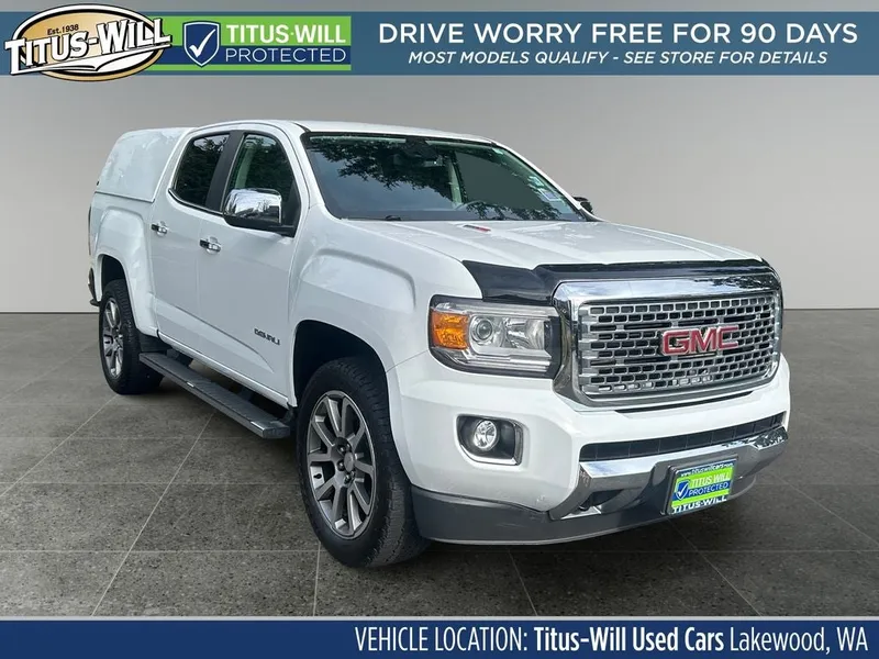 2019 GMC Canyon Denali in White — front three-quarter view