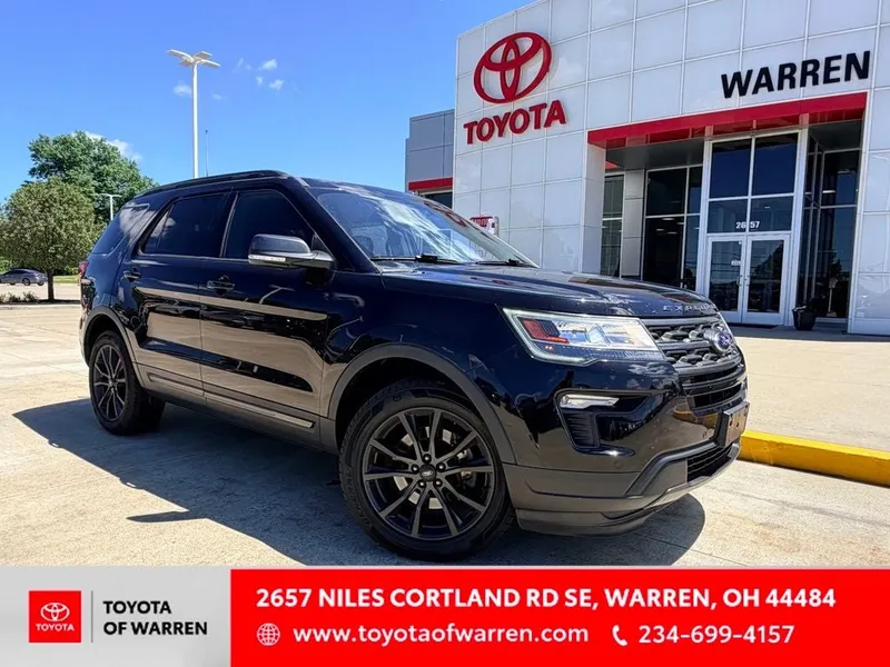 2019 Ford Explorer XLT in Black Metallic — front three-quarter view