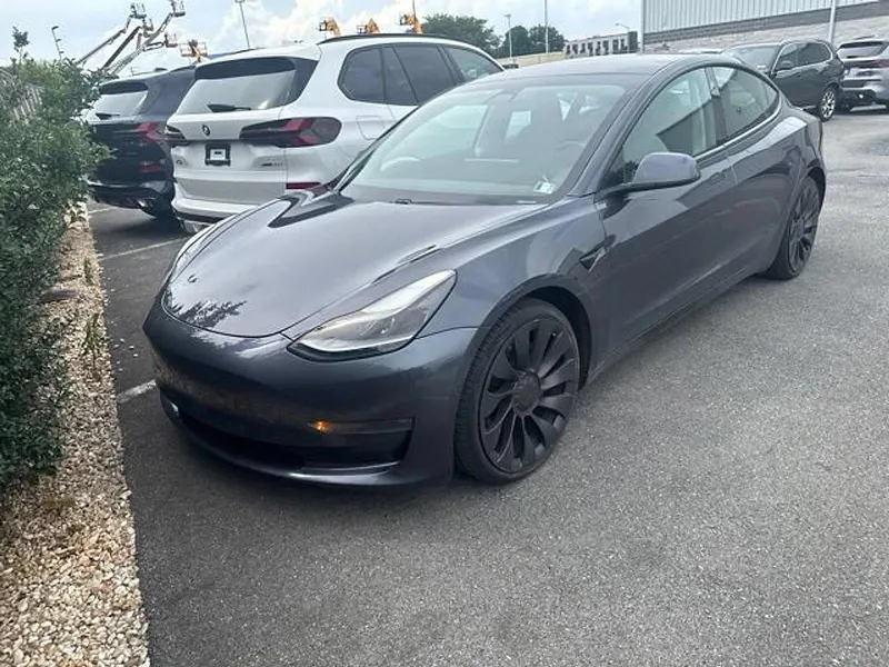 2021 Tesla Model 3 Performance AWD in Solid Black — front three-quarter view