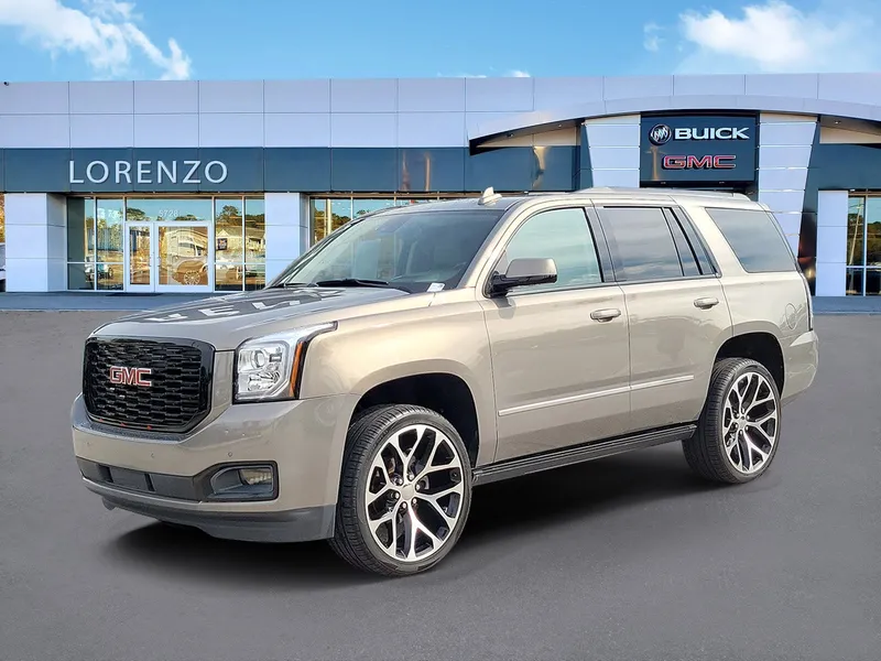 2019 GMC Yukon Denali in Pepperdust Metallic — front three-quarter view