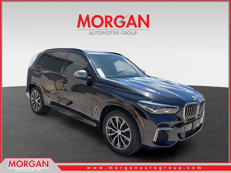 2023 BMW X5 M50i in Black Sapphire Metallic — front three-quarter view