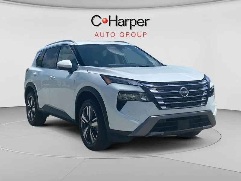 2024 Nissan Rogue SL in Everest White Pearl — front three-quarter view