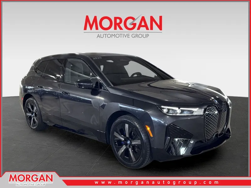 2025 BMW iX xDrive50 in Gray — front three-quarter view