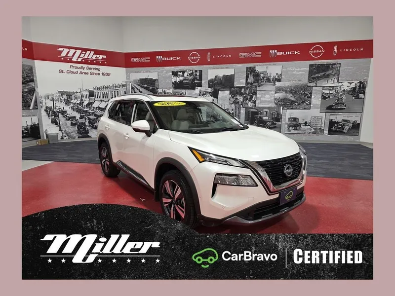 2023 Nissan Rogue SL CarBravo Certified in Pearl White Tricoat — front three-quarter view