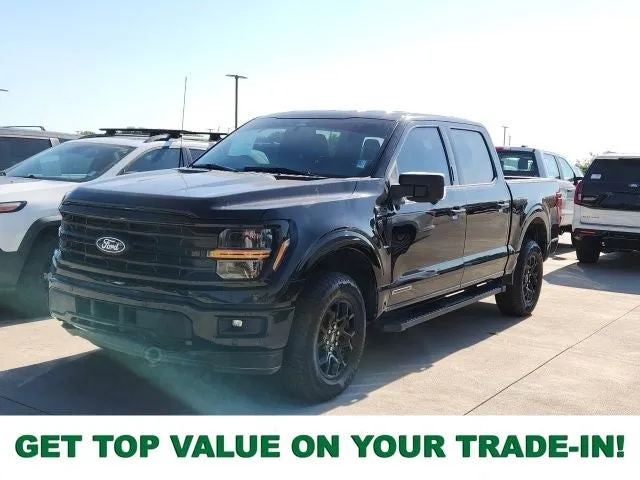 2024 Ford F-150 XLT in Black Metallic — front three-quarter view