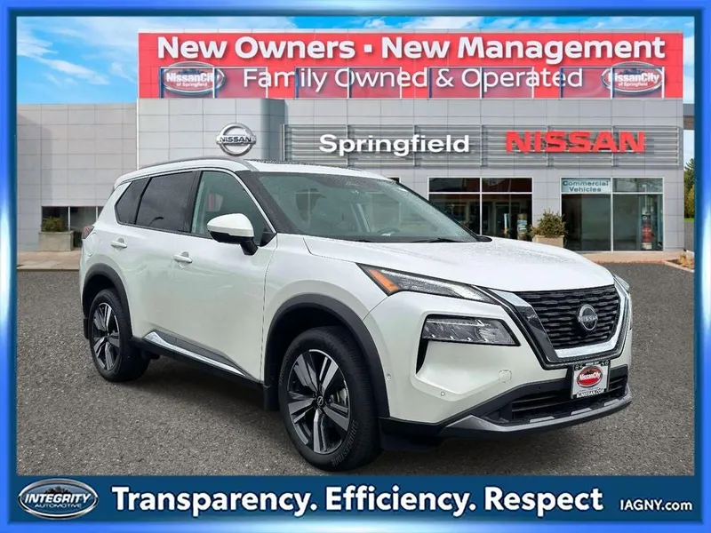 2023 Nissan Rogue SL in Pearl White Tricoat — front three-quarter view