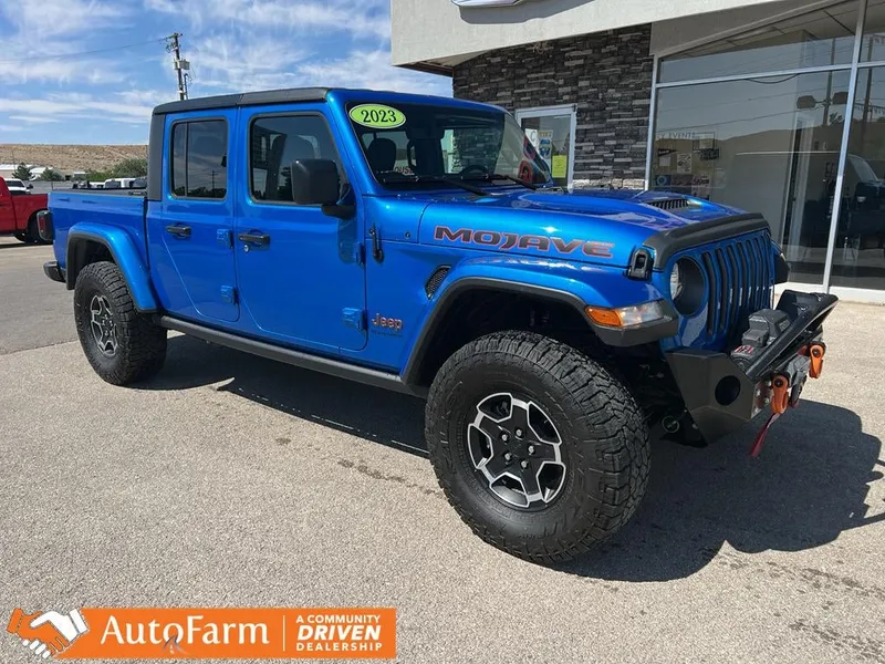 2023 Jeep Gladiator Mojave in Hydro Blue Pearlcoat — front three-quarter view