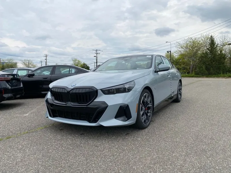 2027 BMW 5 Series 550e xDrive in Brooklyn Grey Metallic — front three-quarter view