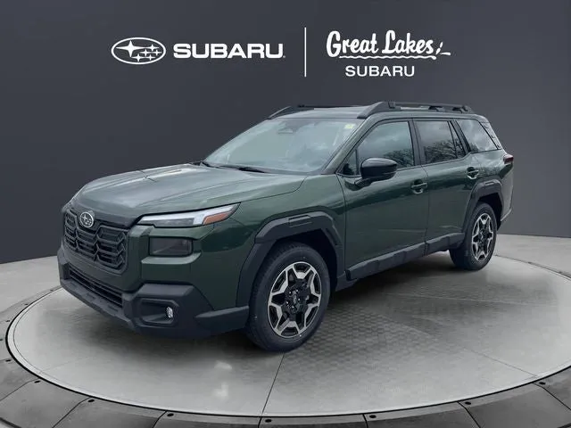 2026 Subaru OUTBACK Touring in Deep Emerald Green Pearl — front three-quarter view