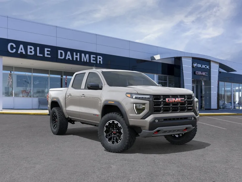 2026 GMC Canyon AT4 in Coastal Dune — front three-quarter view