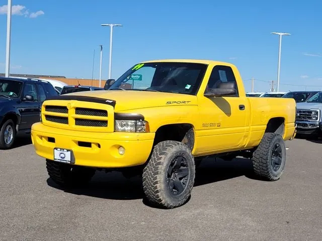 1999 Dodge Ram 1500 ST in Solar — front three-quarter view