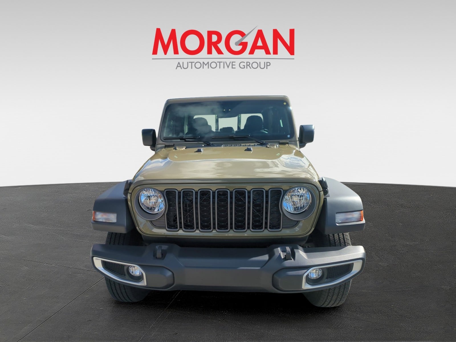 2026 Jeep Gladiator Sport in Green — front three-quarter view