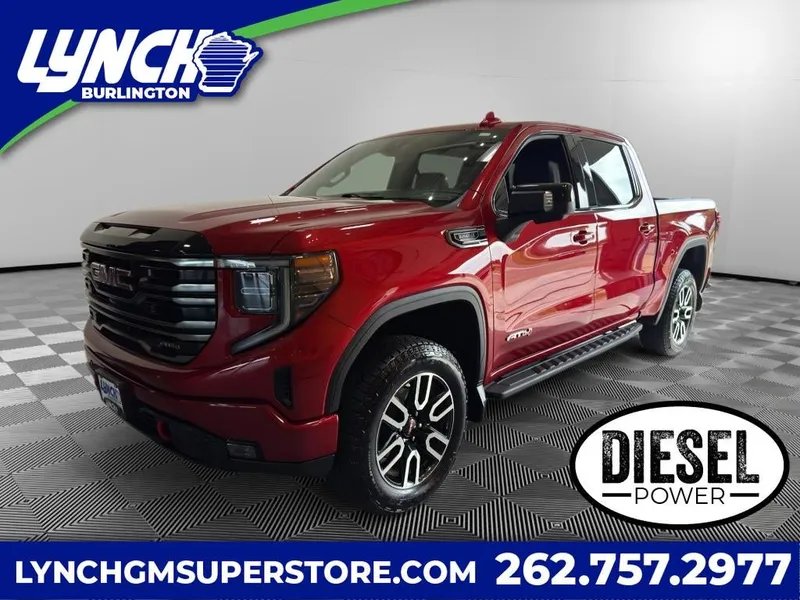 2025 GMC Sierra 1500 AT4 in Volcanic Red Tintcoat — front three-quarter view