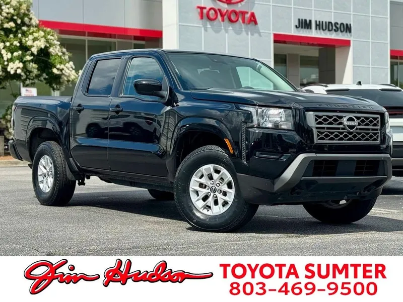 2024 Nissan Frontier SV in Super Black — front three-quarter view