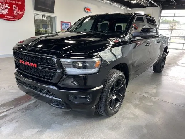 2023 RAM 1500 Big Horn Crew Cab 4x4 5'7' Box in Diamond Black Crystal Pearlcoat — front three-quarter view