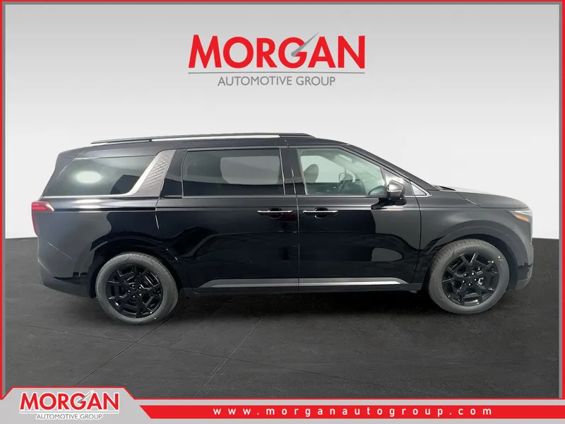 2026 Kia Carnival SX in Aurora Black Pearl — front three-quarter view