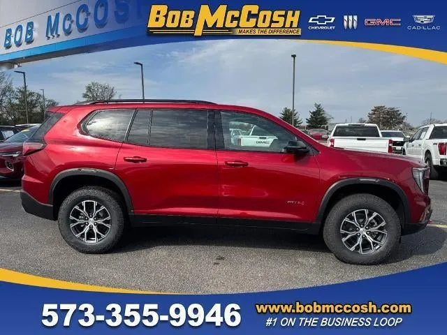2026 GMC Acadia AT4 in Volcanic Red Tintcoat — front three-quarter view