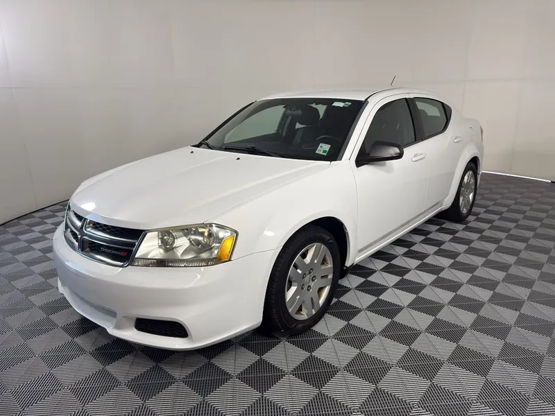 2013 Dodge Avenger SE in White — front three-quarter view
