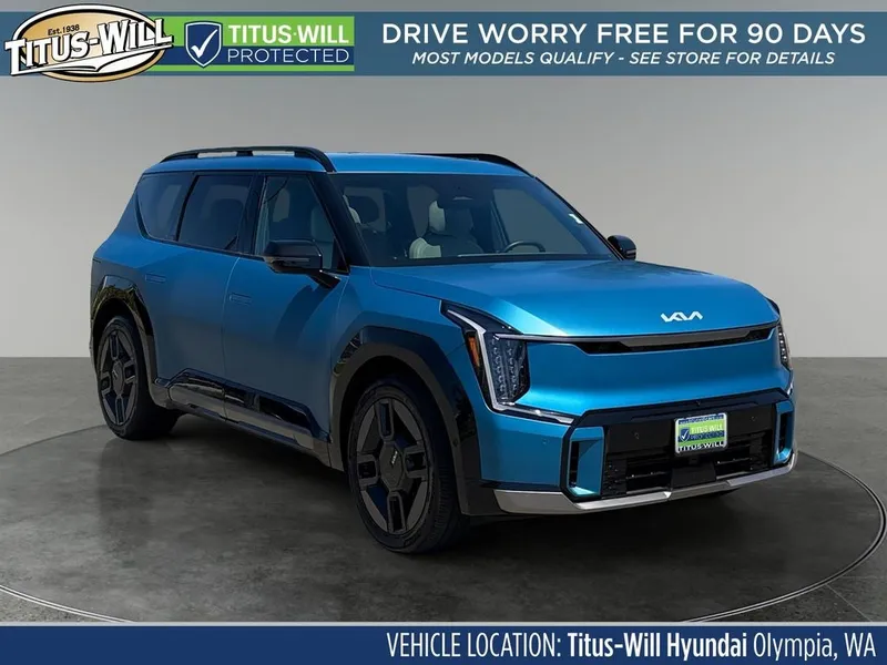 2024 Kia EV9 GT-Line in Ocean Blue Matte — front three-quarter view