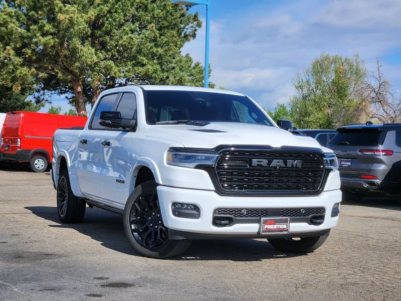 2025 RAM 1500 Limited Crew Cab 4x4 5'7' Box in Bright White Clearcoat — front three-quarter view