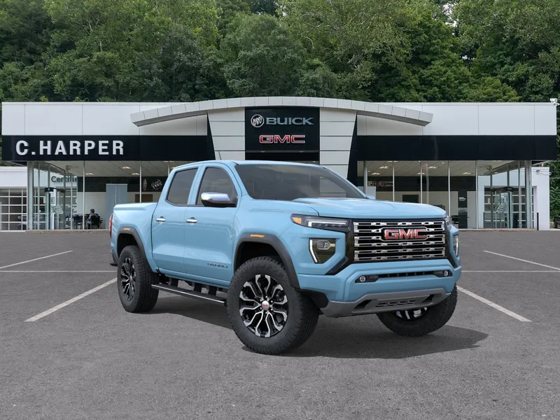 2026 GMC Canyon Denali in Glacier Metallic — front three-quarter view