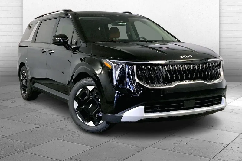2026 Kia Carnival EX in Aurora Black Pearl — front three-quarter view