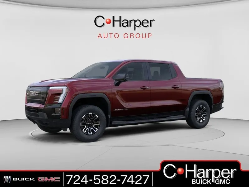 2026 GMC Sierra EV Elevation Standard Range in Dark Ember Metallic — front three-quarter view