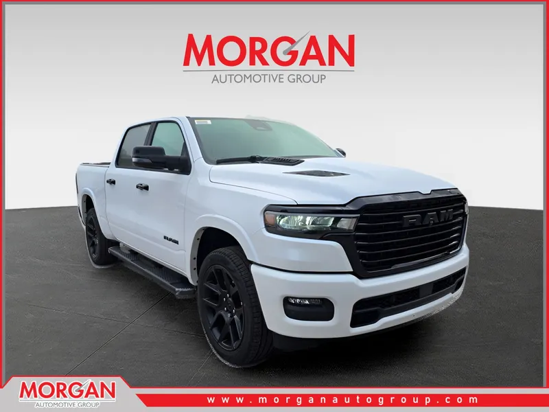 2026 Ram 1500 Laramie in Ivory White Tri-Coat Pearlcoat — front three-quarter view