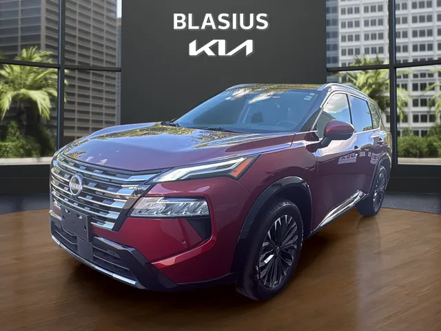 2026 Nissan Rogue Platinum in Scarlet Ember Tintcoat — front three-quarter view