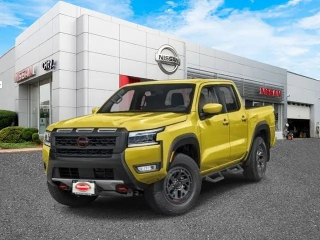 2026 Nissan Frontier PRO-4X in Citrus Strike — front three-quarter view