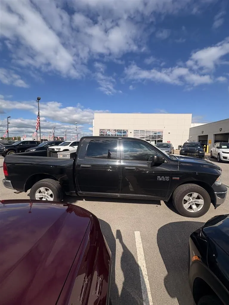 2017 RAM 1500 ST in Brilliant Black Crystal Pearl — front three-quarter view