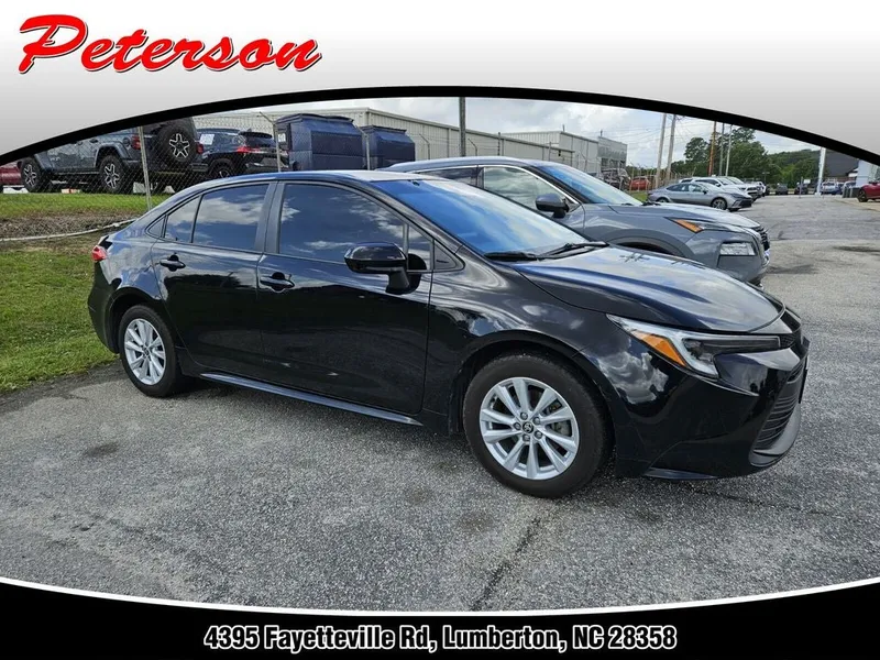 2023 Toyota Corolla Hybrid LE in Midnight Black Metallic — front three-quarter view
