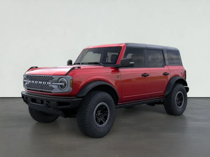 2025 Ford Bronco Badlands in Ruby Red Metallic Tinted Clearcoat — front three-quarter view