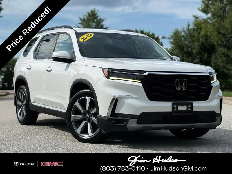 2023 Honda Pilot Touring in Platinum White Pearl — front three-quarter view