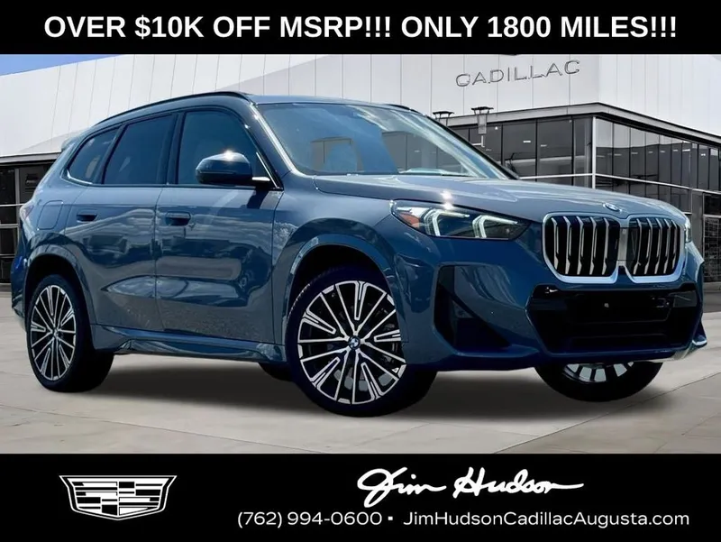 2025 BMW X1 xDrive28i in Storm Bay Metallic — front three-quarter view