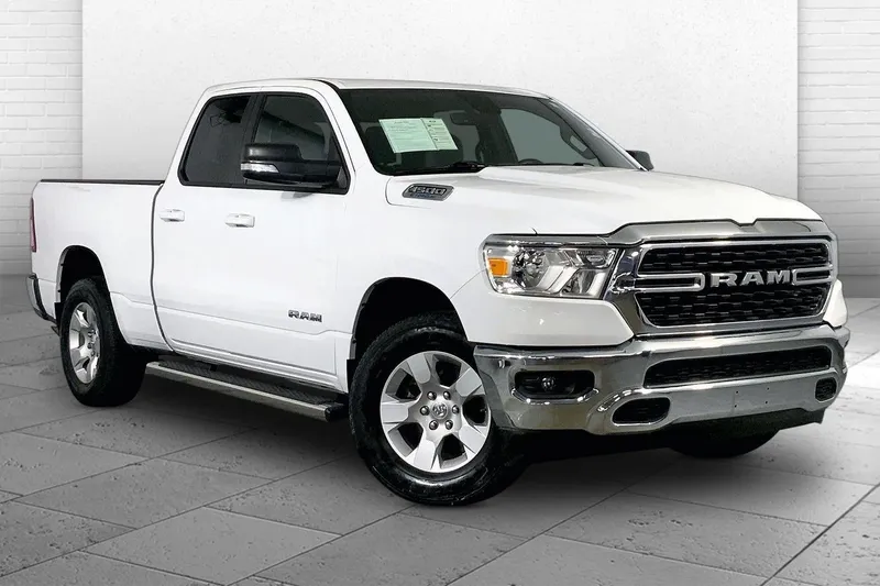 2022 RAM 1500 Big Horn Quad Cab 4x4 6'4' Box in Bright White Clearcoat — front three-quarter view