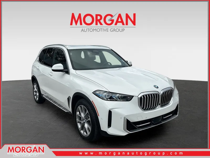 2025 BMW X5 xDrive50e in Alpine White — front three-quarter view