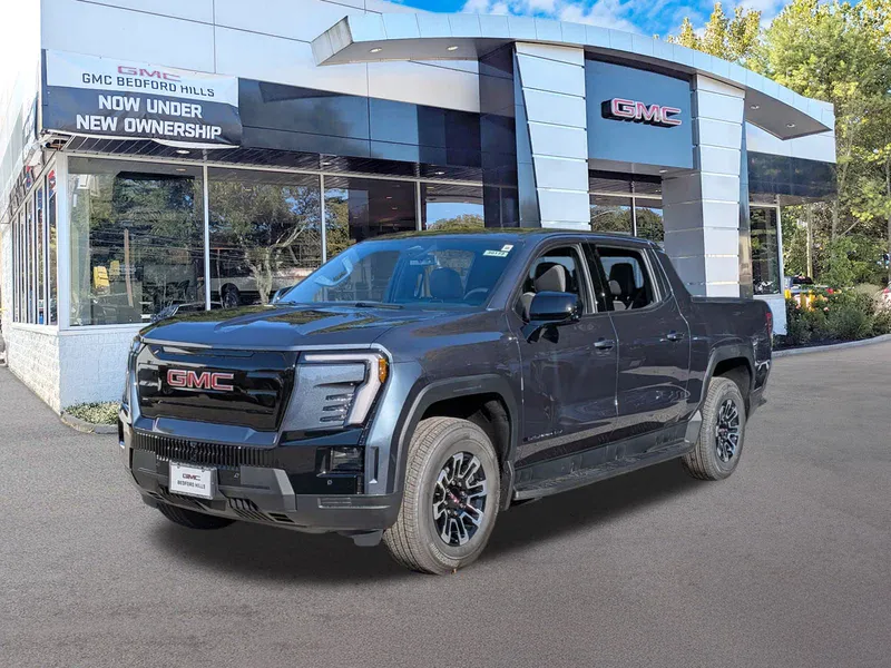 2026 GMC Sierra EV Extended Range Elevation in Deep Ocean Metallic — front three-quarter view