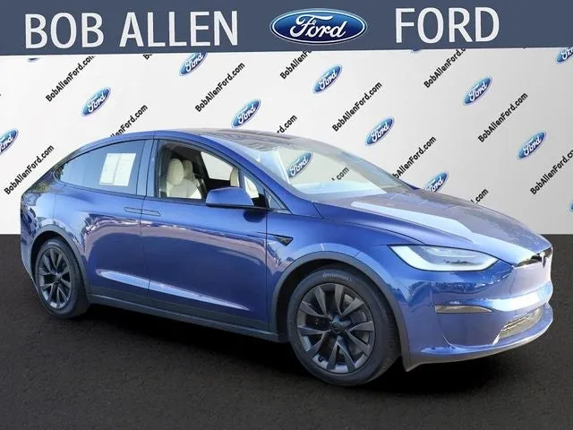 2023 Tesla Model X Base in Deep Blue Metallic — front three-quarter view