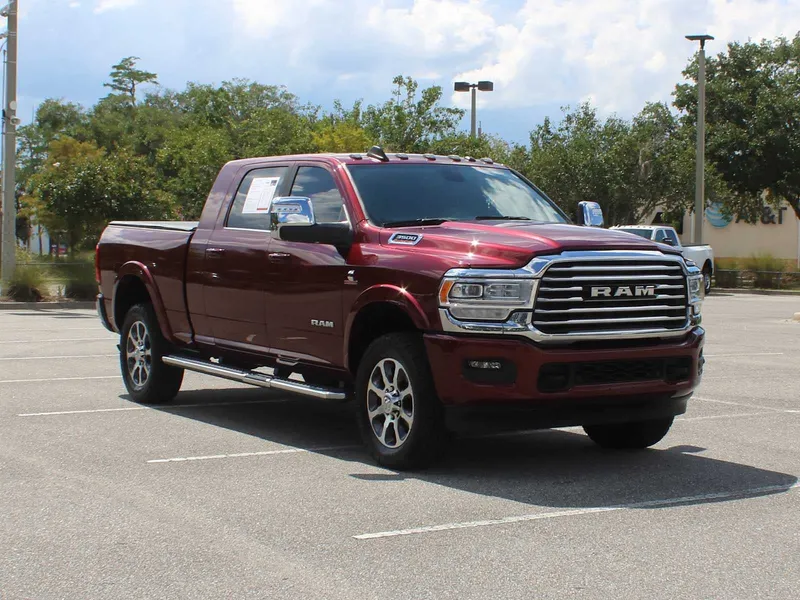 2023 RAM 3500 Longhorn in Delmonico Red Pearlcoat — front three-quarter view