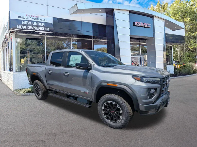 2026 GMC Canyon 4WD AT4 in Sterling Metallic — front three-quarter view