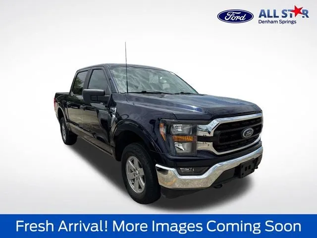 2023 Ford F-150 XLT in Blue Metallic — front three-quarter view