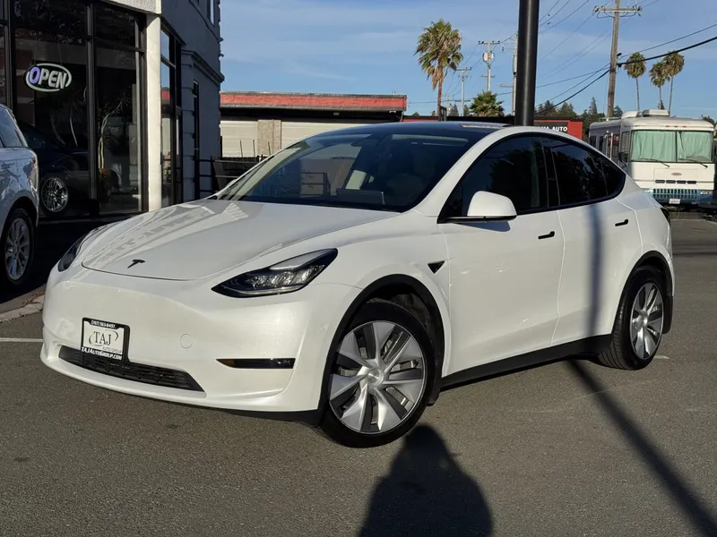 2023 Tesla Model Y in White — front three-quarter view