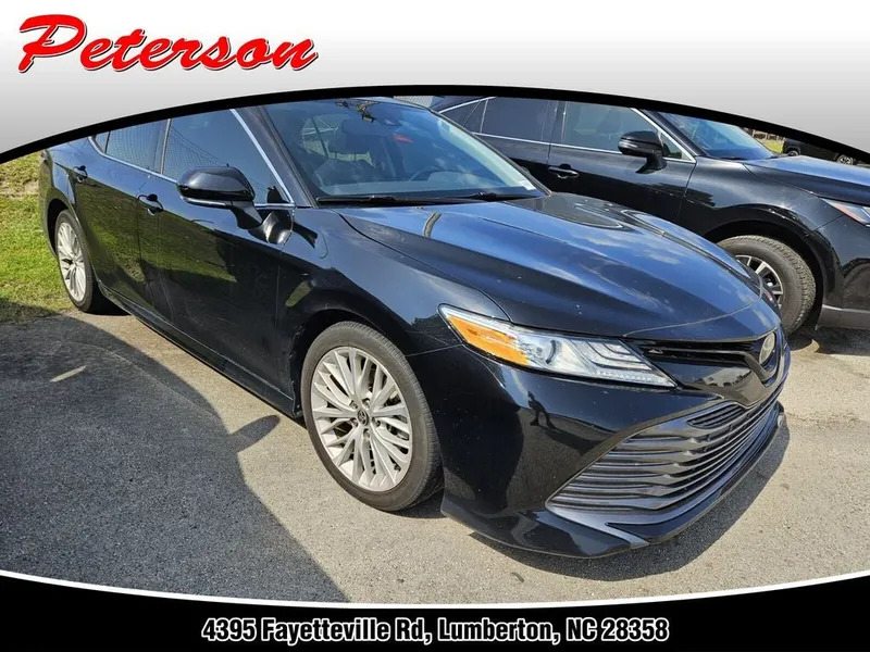 2020 Toyota Camry XLE in Midnight Black Metallic — front three-quarter view