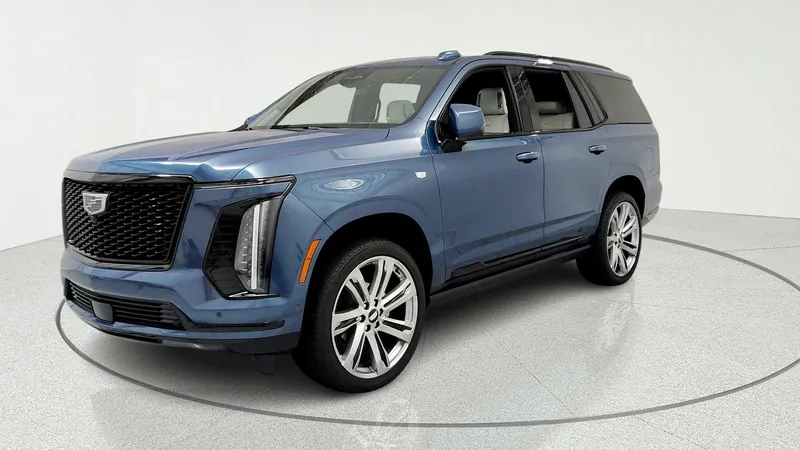 2026 Cadillac Escalade Platinum Sport in Deep Sea Metallic — front three-quarter view