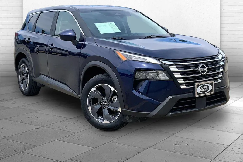 2025 Nissan Rogue SV in Deep Ocean Blue P — front three-quarter view