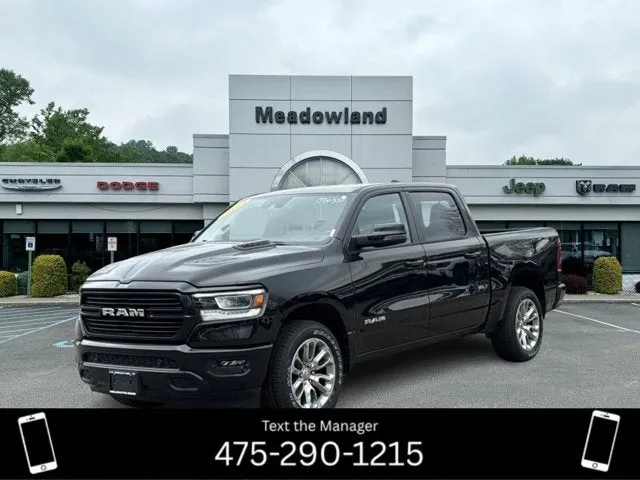 2023 RAM 1500 Laramie in Diamond Black Crystal Pearlcoat — front three-quarter view